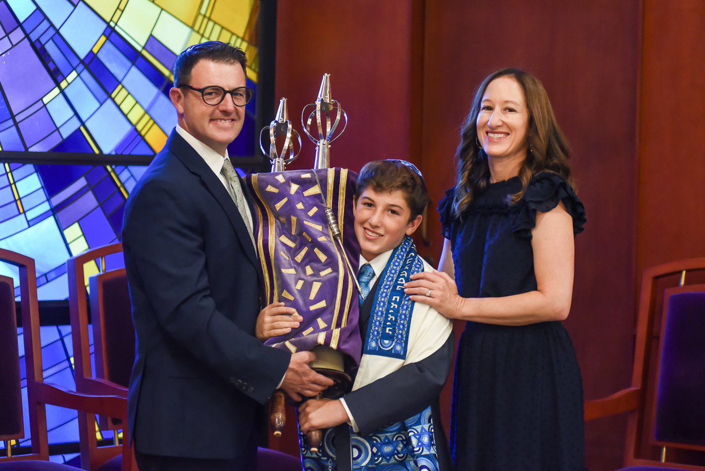 Bar mitzvah family portrait with Torah