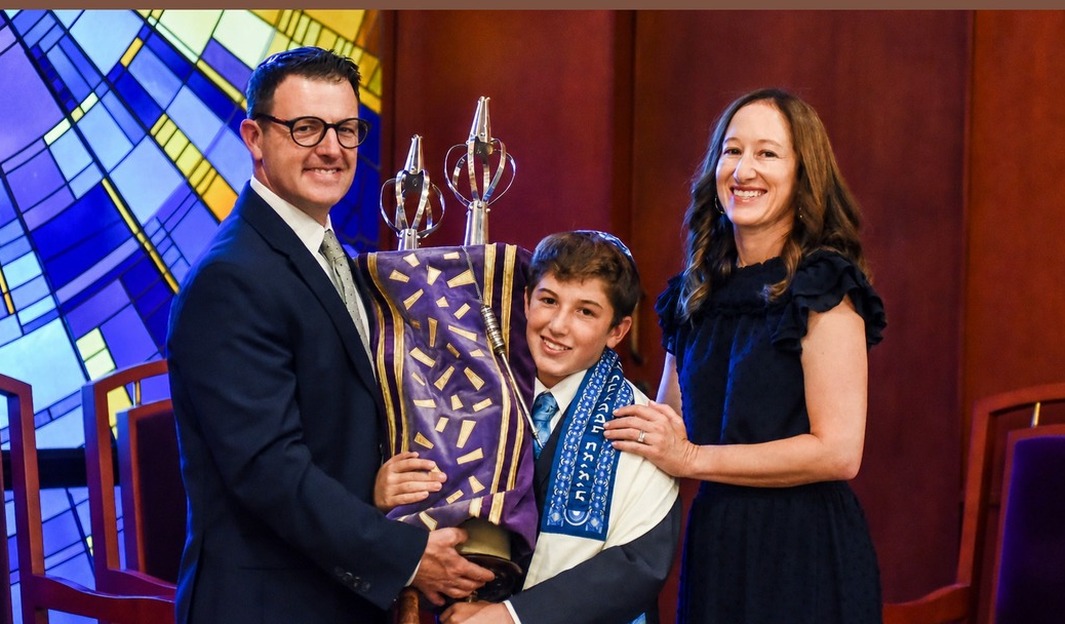 Bar mitzvah family portrait with Torah
